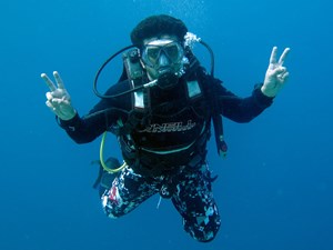 Diver hovering in shorts