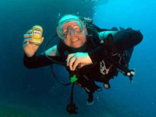 Who's round is it? Diver on wreck with beer can